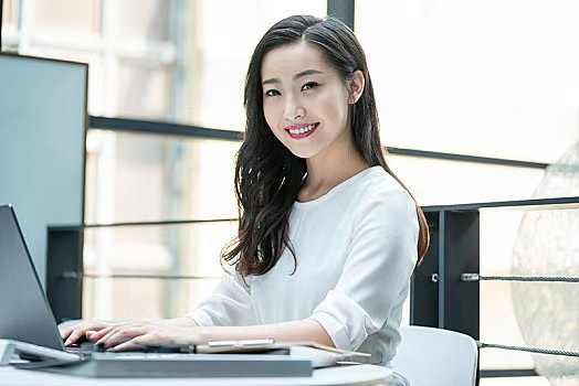 Woman working with Laptop Computer